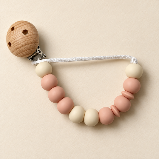 Chupetero artesanal de silicona rosa y crema con pinza de madera